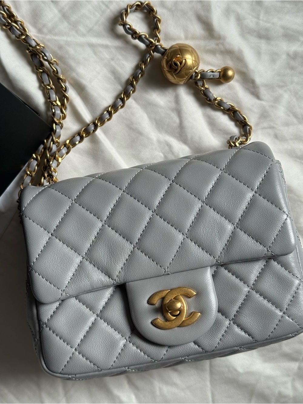 CHANEL Quilted Lambskin Mini Flap Bag in Light Gray with Gold Hardware
